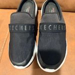 Skechers  Men's Black and White Slip-On Loafers Photo 0