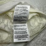 Bebe White Lace Sheer Long Sleeve Bodysuit. Size: Medium. Photo 4