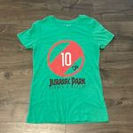 Women’s Green Jurassic Park Search & Rescue Short Sleeve Baby Tee, Size Medium Photo 0