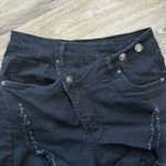 NWOT fashion black ripped jean shorts. Cross over Photo 1