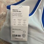 Athleta Blue and White Sports Bra with Seamless Design Photo 1