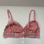 Xhilaration  Lace Bralette in Soft Pink  Chic lace bralette with delicate floral design.  Photo 1