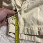 H&M  women's medium elastic waist shorts light yellow with pockets rolled hem Photo 3