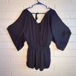 White House | Black Market  Elegant Black Garment Photo 1