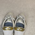 New Balance  Women's Cream and Gold Athletic Shoes Photo 2