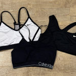 Lot of 3 Sports Bras Size Medium, White , Black Nike and Black Calvin Klein Photo 0