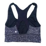 Lululemon Athletica speckled black and white criss cross sports bra size 4 Photo 1
