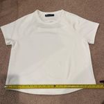 Under Armour Women's white loose baggy short sleeve too Photo 3