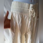 Open Edit  | Ivory rayon wide leg smocked waist drawstring palazzo pants Photo 4