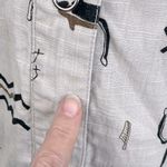 Chico's Stretchy Jean Jacket Snap Front Tan w Black Cave Drawing Design-3/Large Photo 2