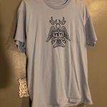 Yeti  Tee Shirt Photo 0