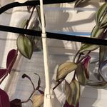 Saints + Secrets Romper Photo 3