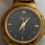 Bill Blass  23mm Quartz analog Womens gold tone black dial up to 7.5” runs Photo 1