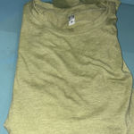 Elevate your wardrobe with this stylish green long sleeve top. Perfect for any occasion, it offers comfort and elegance. NWOT Polyester/Rayon/spandex blend Pit to pit 18” approx laying flat Size M Photo 3