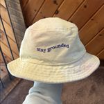 Pac Sun Desert Dreamer “stay grounded” embriodered bucket hat Yellow Photo 1