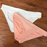 No Boundaries Set of 2  Peach & White Swimsuit Bottom - Size Medium. ***refer to measurements. Never warn & excellent condition. Measurements approximately 14” from hip not fully stretched out from elastic band x 9”. Non-smoking home. priced to sell at as is condition. Don’t like my price, make reasonable offer! And thank you for checking my closet. Photo 0
