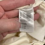 American Eagle  Cream Highest Rise Belted Paperbag Waist Cropped Wide Leg Pants Photo 3