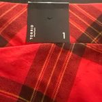 Torrid NWT--RED PLAID LEGGINGS-SIZE 1X Gorgeous red plaid leggings, has some stretch, brand new with tags, 95% cotton and 5% spandex, size 1x Measurements: Waist: side to side 16-19 inches Rise: 8 inches Inseam: 27 inches Photo 7