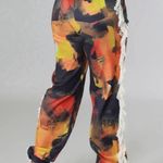 Micas  Orange Abstract Print Fringe Trim Pants Photo 2