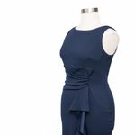 Betsy and Adam . Christine Scuba Crepe Ruffled Bow Gown. Photo 7