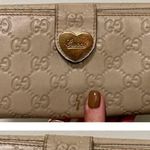 Guccissima Leather Engraved Heart Continental Wallet | Ivory Photo 1