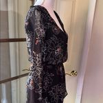 ASTR  Black and White Floral Romper with Bell Sleeves Photo 6