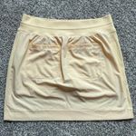 Athleta light yellow mini tennis skirt size 4 Photo 2