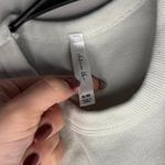 White and silver baby tank top that says BABY in rhinestones size small/medium Photo 1