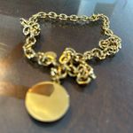 Gold tone coin pendant necklace with a round charm and chain Photo 3