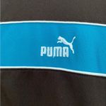 Puma Women’s vintage track jacket medium
Black zip up with blue stripe Photo 3