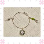 ALEX AND ANI Bracelet - Starbucks - Tinkerbell - bangle, adjustable, charms, silver tone. 2nd Starbucks on the right (Peter Pan movie reference) gently used - no flaws. Smoke free home. Photo 1
