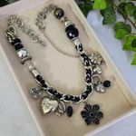 Silver and Black Charm Necklace Mixed Media Photo 0