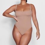 SKIMS Fits Everybody Square Neck Thong Bodysuit in Sienna Photo 1