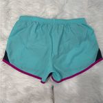 Nike Womens Size Small Teal and Magenta Athletic Running Shorts Photo 1