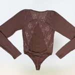 Brown lacey coquette long sleeved body suit size S Photo 0