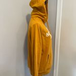 The North Face  Women’s Sz: M Hoodie Sweatshirt Mustard Yellow Logo Pullover. Photo 2