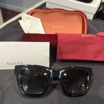 Gucci GG1714S cat-eye sunglasses with a black frame and solid grey lenses Photo 0