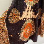 Deep Exports, featuring black background with orange and white circular patterns Size L Photo 6