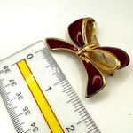 AAI red enamel and gold tone bow brooch Photo 2