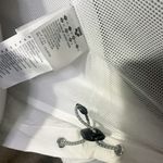 Arena windbreaker full zip jacket raincoat long sleeve tie cuff white grey NWT  New with tag  Same day shipping  Smoke and pets free  This  windbreaker jacket is perfect for outdoor enthusiasts who want to stay comfortable and stylish in any weather. The adjustable tie hem and full zip closure and water-resistant feature make it a great choice for rain or shine. The jacket has a short length with a tie cuff, and the white and grey color combination with the logo accents give it a trendy look.   The jacket is made of 100% polyester and is available in men size XS/ woman size M. It is suitable for both men and women, making it a versatile piece for any wardrobe. Whether you're running errands or hitting the trails, this  windbreaker is the perfect choice. Photo 4