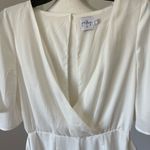 Princess Polly playsuit romper with mock wrap skirt in a size 6 Photo 8