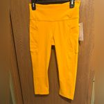 Athleta  Ultimate Stash 11 Capri , Women's Size Medium, Yellow NWT Photo 1