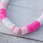 Pink & White Stretch Bracelet with a Smiley Face Photo 1