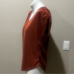 Green envelope orange stretchy top Photo 2