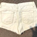 Free People NWOT Shark Bite distressed white denim shorts. Sz 27 and rise 9” Photo 2
