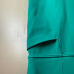 Athleta  Revelation Laser Cut Kelly Green Powervita 25" Leggings Pockets Size M Photo 4