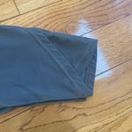 Athleta Salutation Stash Wrap Tight leggings cutouts pockets Hematite Grey Sz LP Photo 8