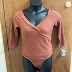 ASTR Rust Orange Ribbed 3/4 Sleeve Bodysuit Photo 0