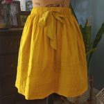 Anthropologie  Odille Drawing Parallels Pleated Pocket Skirt in Marigold Yellow Photo 9