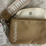 Lululemon Dual Pouch Wristlet in Tan and Cream Photo 1